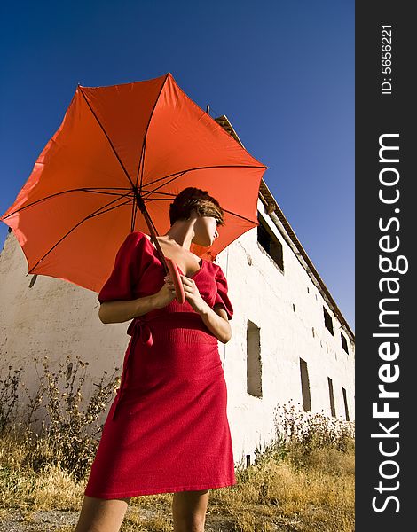 Woman with umbrella, both in red. Woman with umbrella, both in red.