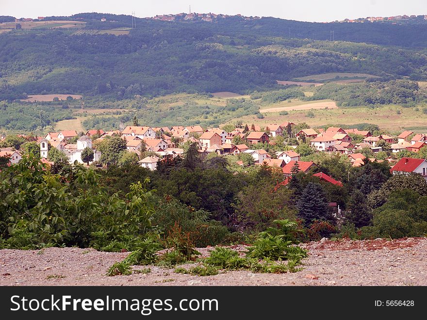 Rural landscape with houses and green hills in Serbia. Rural landscape with houses and green hills in Serbia