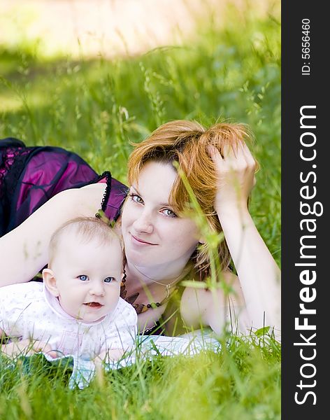 Mother and little child relaxing in the park