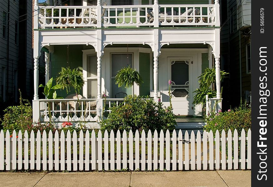 A white picket fence surrounds this beautiful white country home in Ocean Grove, NJ. A white picket fence surrounds this beautiful white country home in Ocean Grove, NJ.