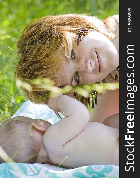 Mother and little child relaxing in the park