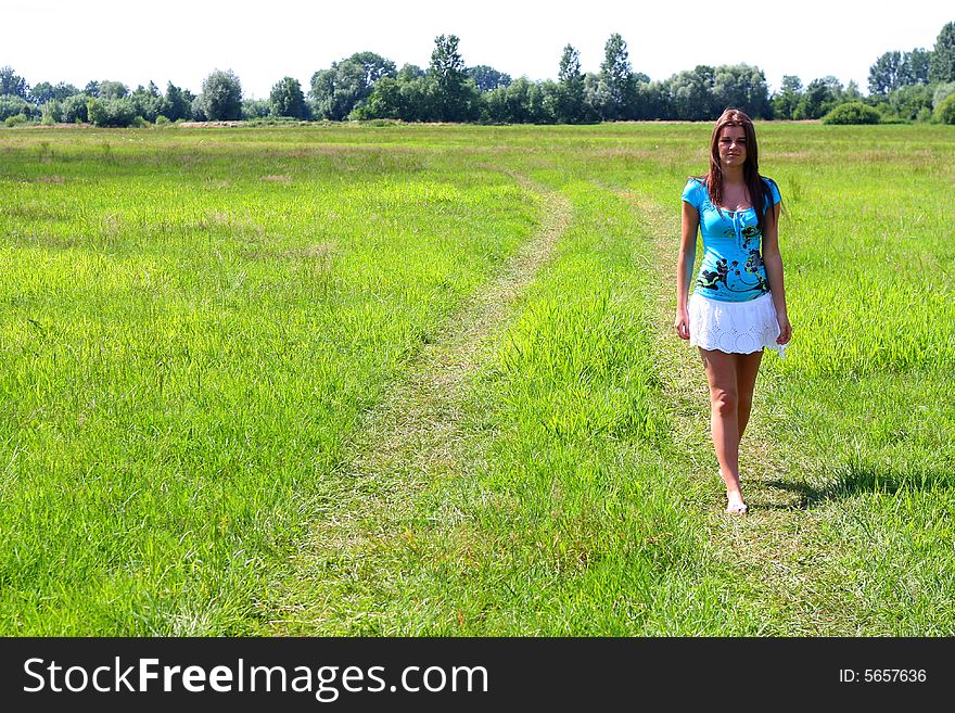 Young woman on the meadow in the summer. Young woman on the meadow in the summer.