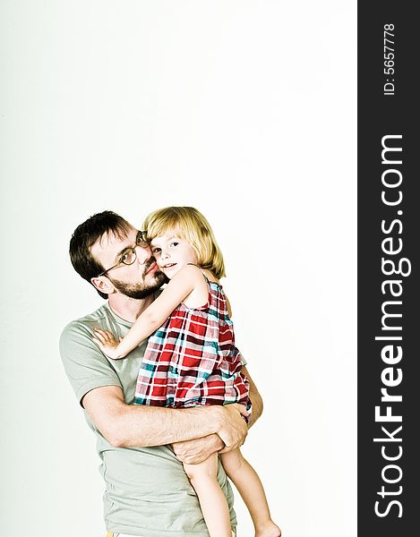 Father and daughter, photographed in the studio. Father and daughter, photographed in the studio.