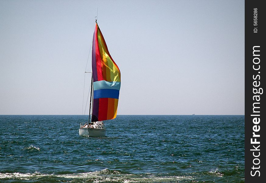Colorful spinnaker on a summer afternoon. Colorful spinnaker on a summer afternoon.