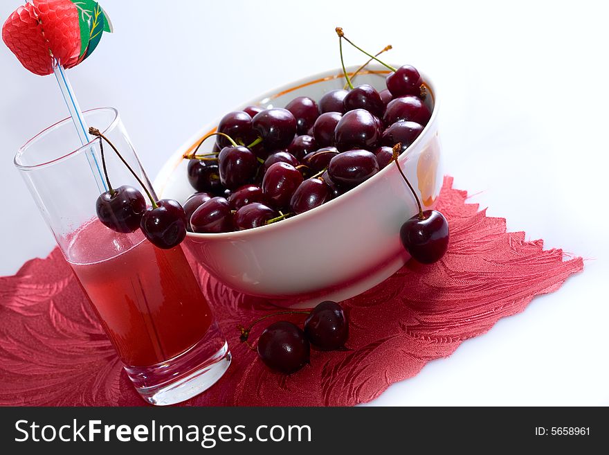 Ripe sweet cherry in a plate