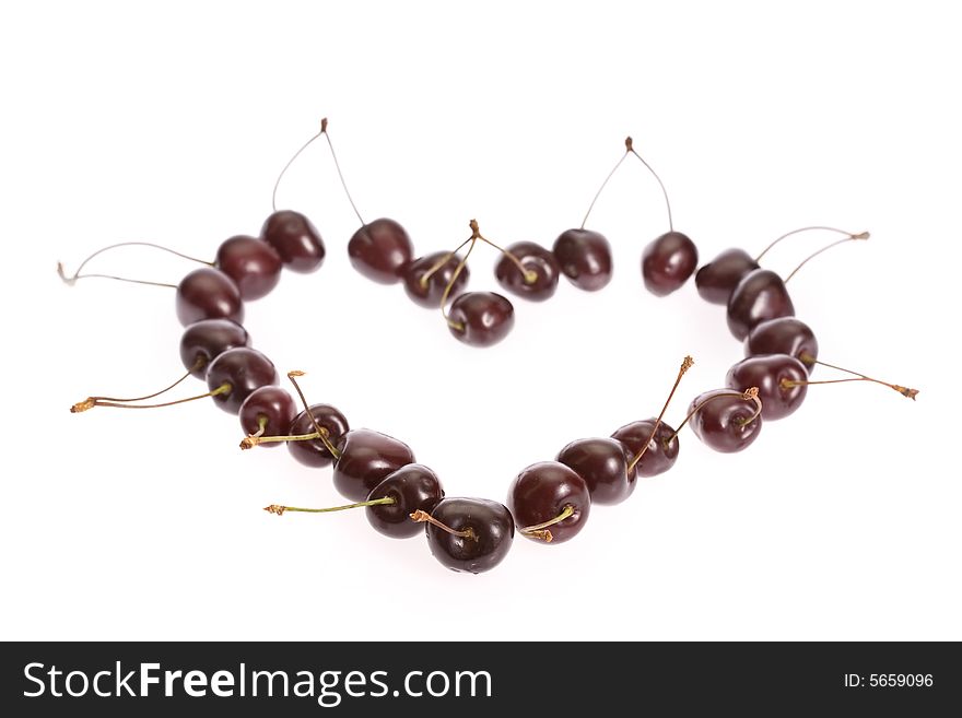 The berries of the sweet cherry which has been laid out in the form of heart