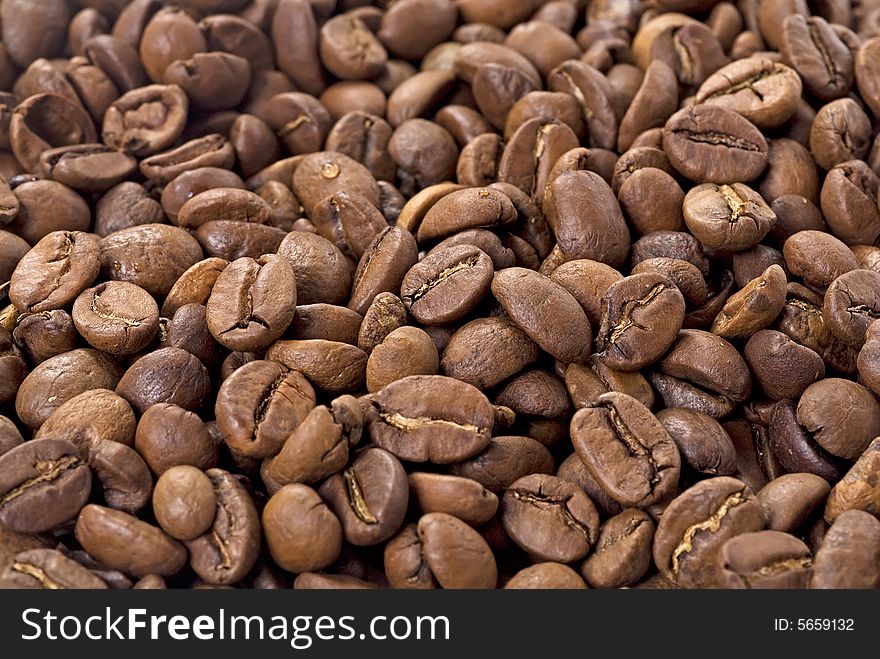 Coffee beans closeup. Astract background. Coffee beans closeup. Astract background.