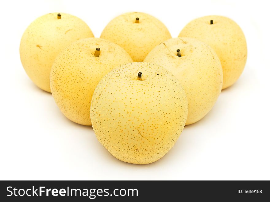 Six nashi pears arranged in triangle shape on white background.