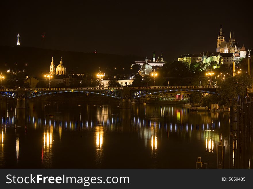 Panoramic night view to Lesser Town, Prague castle, St. Nicholas church and Petrin Tower. Panoramic night view to Lesser Town, Prague castle, St. Nicholas church and Petrin Tower.