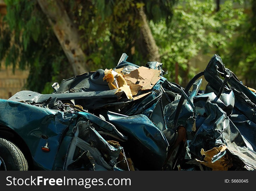 Crashed car and trees