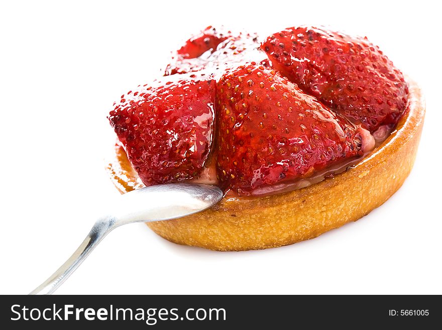 Round cake with parts of a strawberry close up. Round cake with parts of a strawberry close up