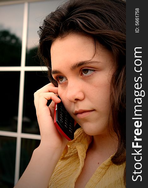 Teen girl mad talking on cell phone