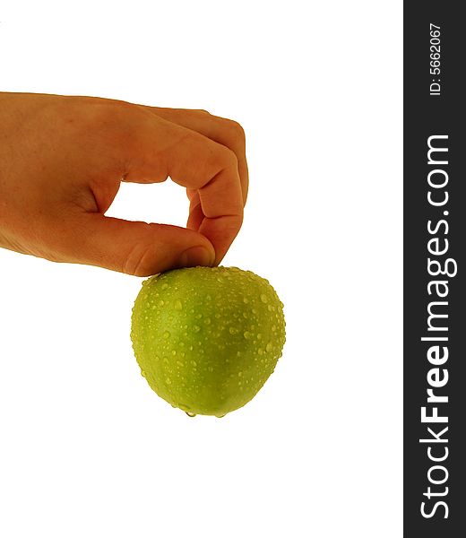 Green apple at human hand on white. Green apple at human hand on white