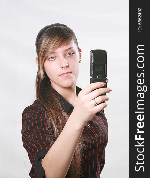 Girl Holds A Mobile Phone