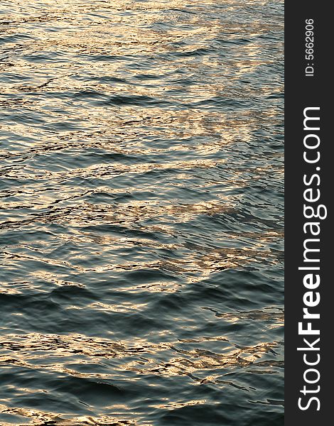 Water or sea surface with golden glow