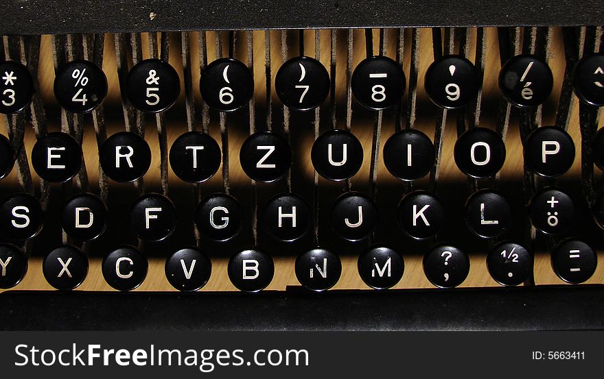 Old Manual Typewriter Keyboard whit yellow background.