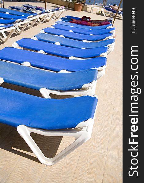 Blue deck-chairs in hotel