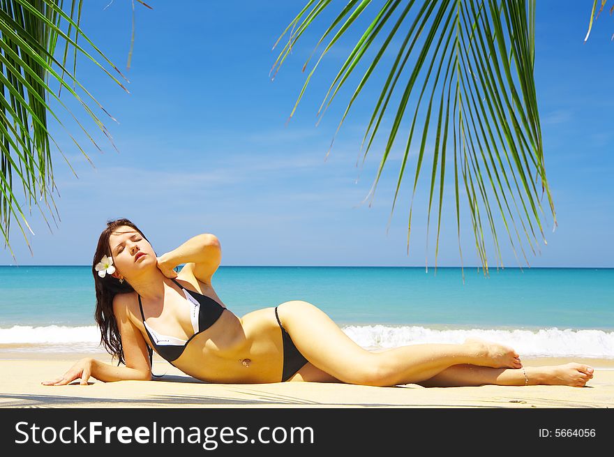 View of a nice young female in tropical environment. View of a nice young female in tropical environment