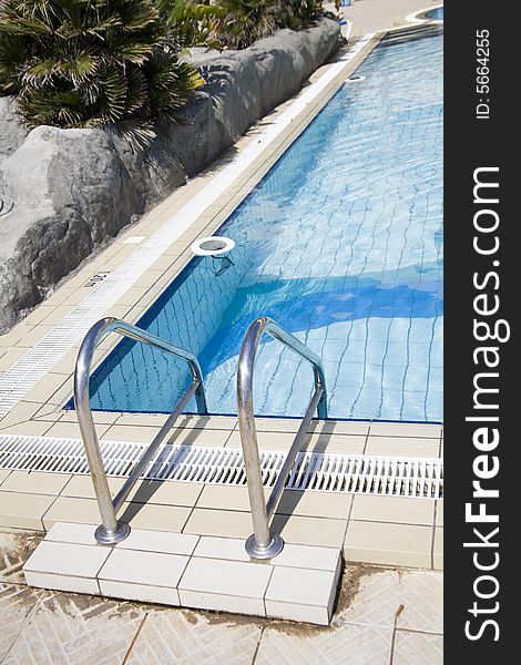 Wellness pool with blue water and rocks