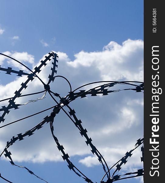 Barbed wire on a background of the sky.