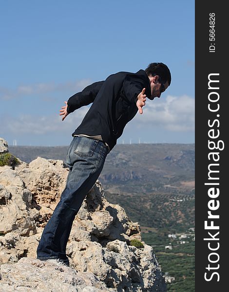 Man leaning against the strong wind