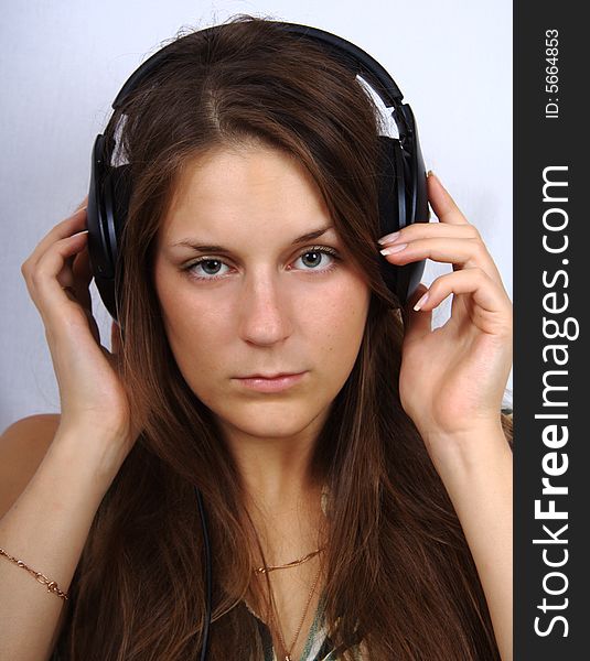 Young girl in headphone listening a music. Young girl in headphone listening a music