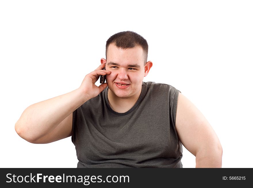 The large man speaks through mobile phone. The large man speaks through mobile phone