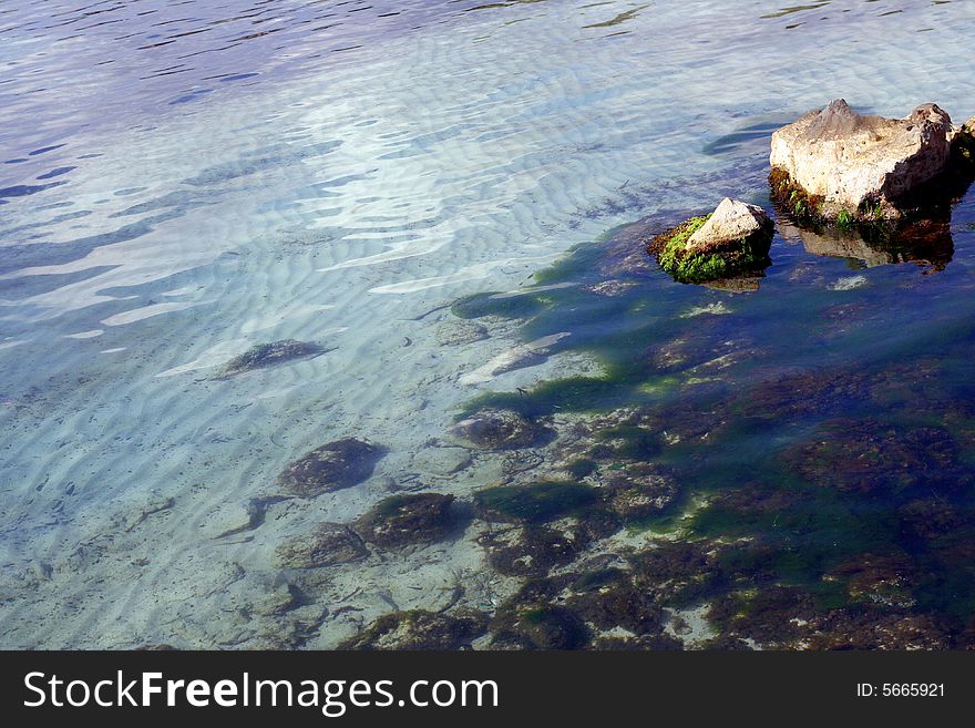 Sea water big stones and sand. Background relax. Sea water big stones and sand. Background relax