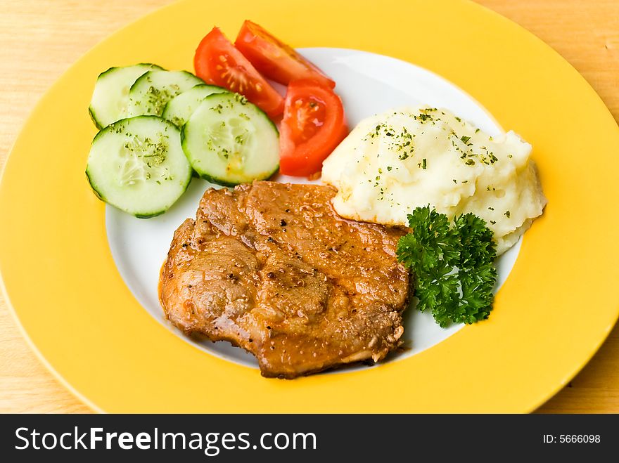 Barbecue with steaks of pork,puree potatoes,salad