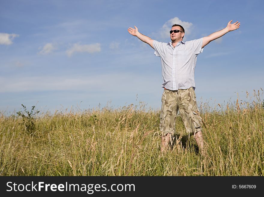 Happy man relaxing on meadow. Happy man relaxing on meadow