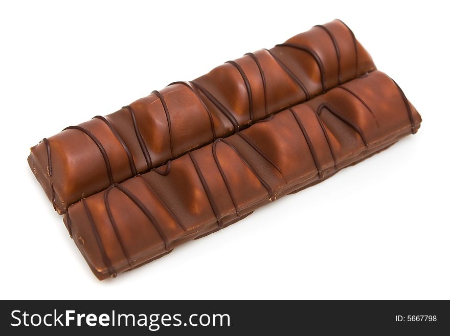 Milk chocolate bars covered wafer on white background.