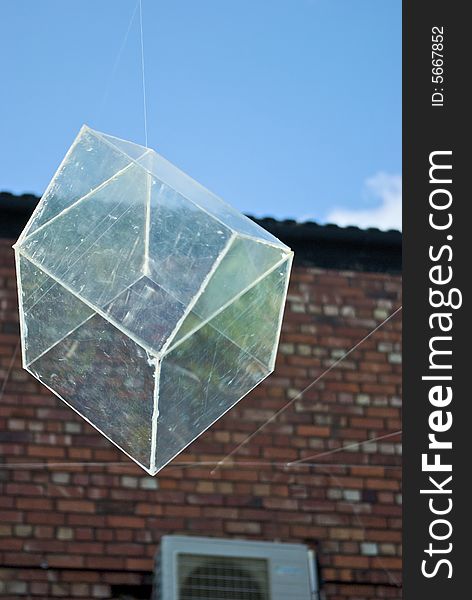 Installation art piece with floating perspex houses suspended on wire to look like polygonal soap bubbles, one isolated in close up. Installation art piece with floating perspex houses suspended on wire to look like polygonal soap bubbles, one isolated in close up