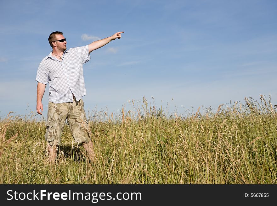 Happy man relaxing on meadow. Happy man relaxing on meadow