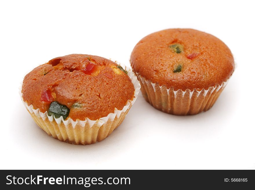 Two muffins put together on white background.