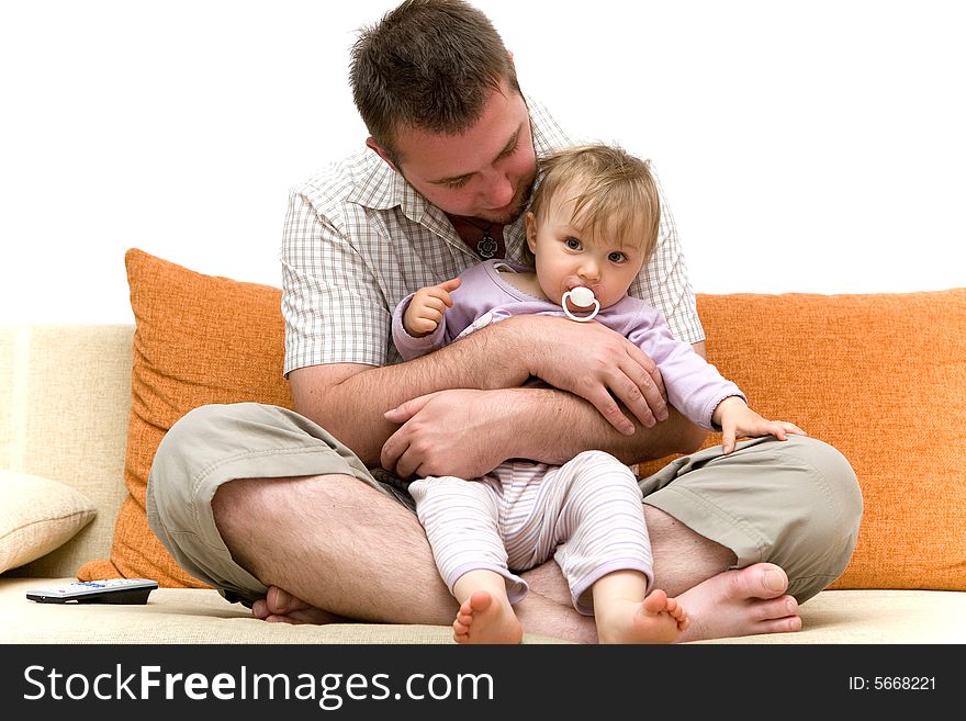 Father and baby girl playing on sofa. Father and baby girl playing on sofa