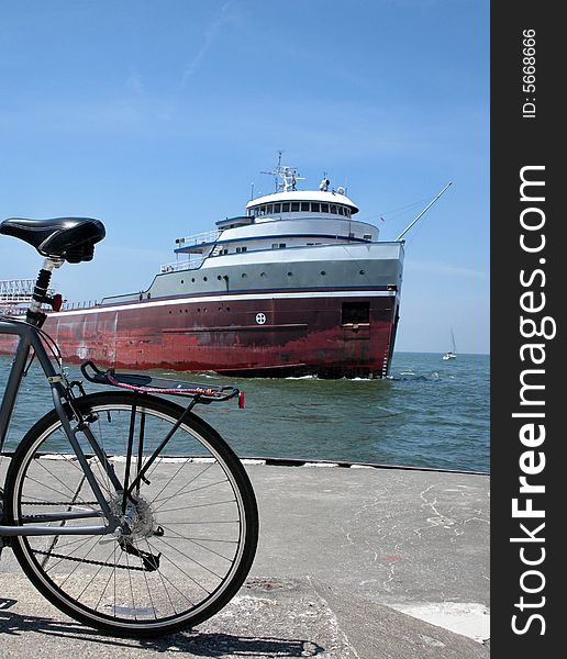 Bicycle and freighter in the harbor. Bicycle and freighter in the harbor.