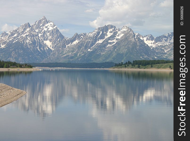 The Grand Teton Mountains in the US, Wyoming as reflected in a lake. The Grand Teton Mountains in the US, Wyoming as reflected in a lake.