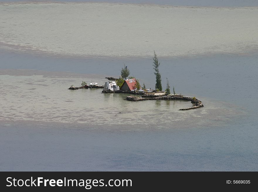 A farm set on a tiny island off the coast of Bora Bora, Tahiti. A farm set on a tiny island off the coast of Bora Bora, Tahiti.