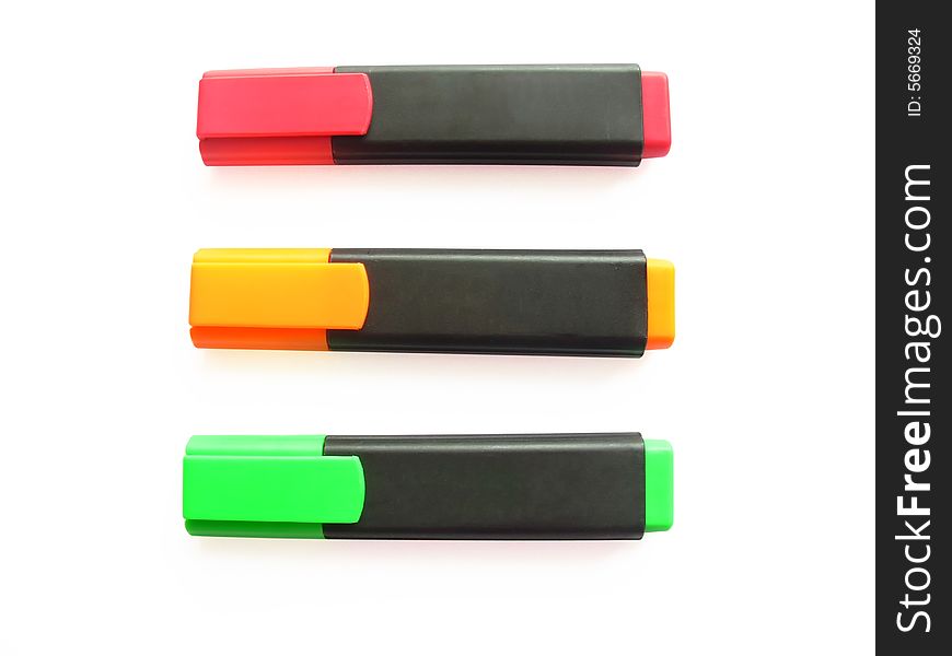Three markers on a white background