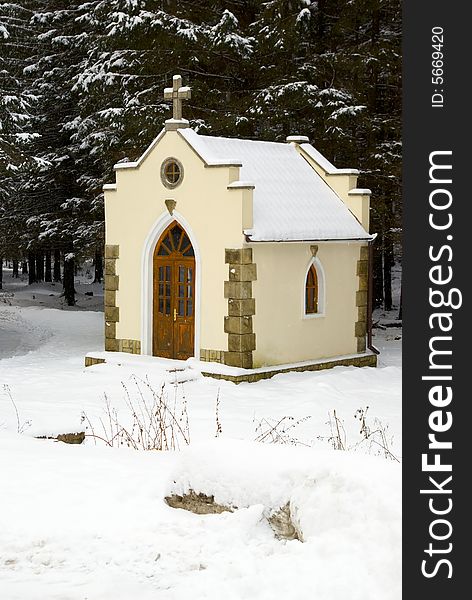 Small chapel in a snow-covered wood. Small chapel in a snow-covered wood