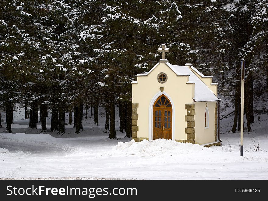 Small chapel in a snow-covered wood. Small chapel in a snow-covered wood