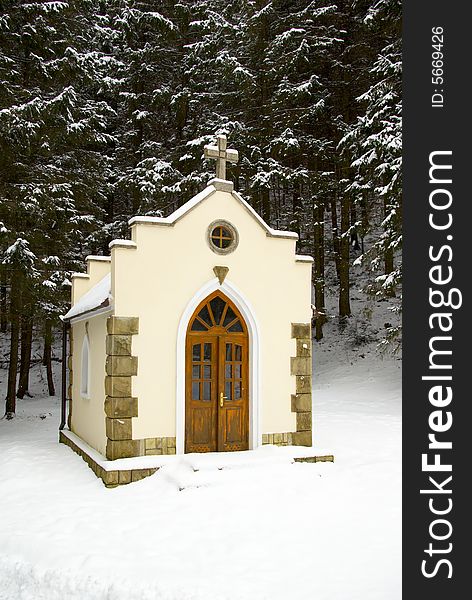 Small chapel in a snow-covered wood. Small chapel in a snow-covered wood