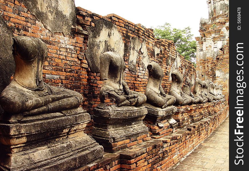 Damaged beheaded or Headless buddha statues in temple of Wat Chai Wattanaram in Ayutthaya near Bangkok, Thailand. Damaged beheaded or Headless buddha statues in temple of Wat Chai Wattanaram in Ayutthaya near Bangkok, Thailand