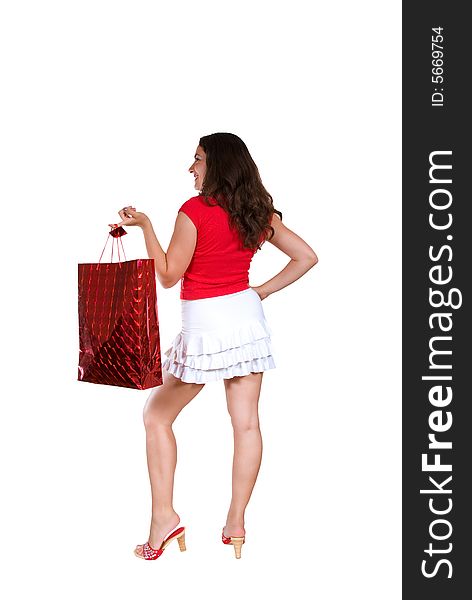 A beautiful girl, dressed in red shirt and white mini skirt, wearing red shoes, holding a red paper box. A beautiful girl, dressed in red shirt and white mini skirt, wearing red shoes, holding a red paper box