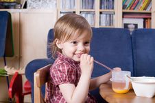 Little Girl Drinking Fresh Orange Juice Stock Photo