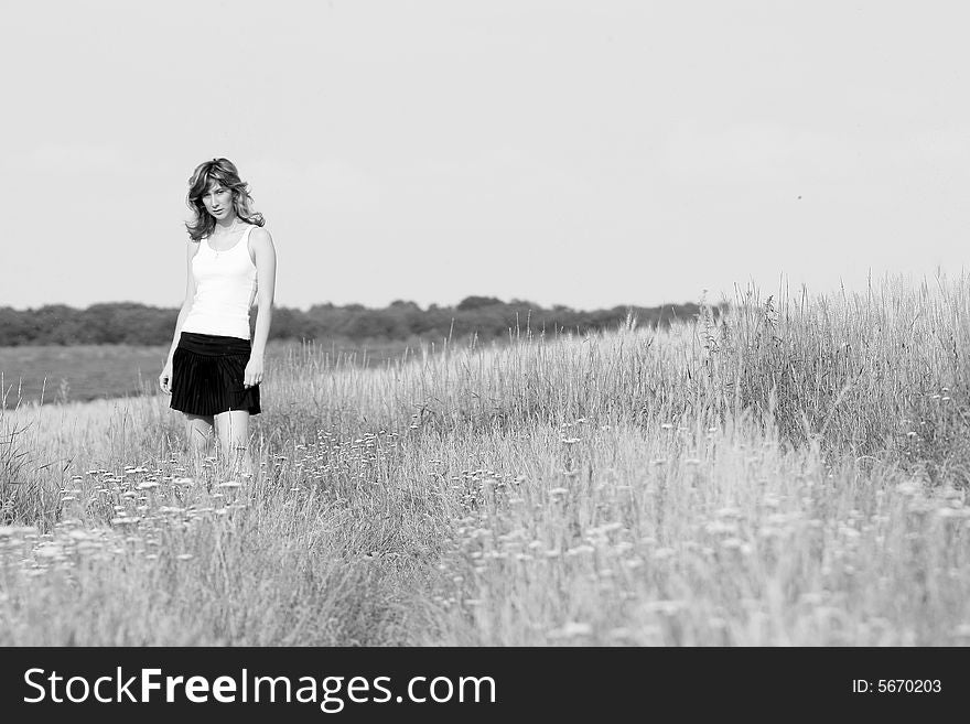 A beautiful girl running on the field