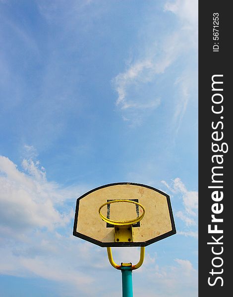 The backboard with a blue sky background .