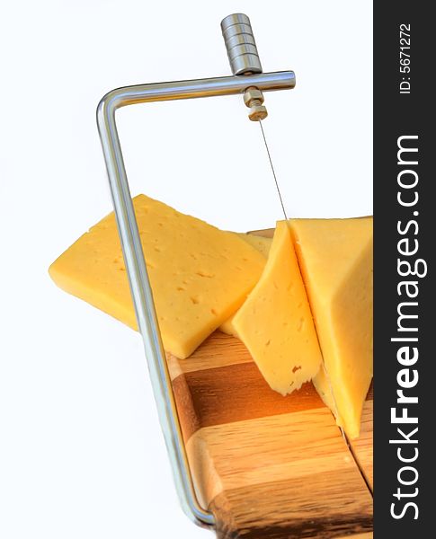 Board for cutting cheese and cheese on a white background