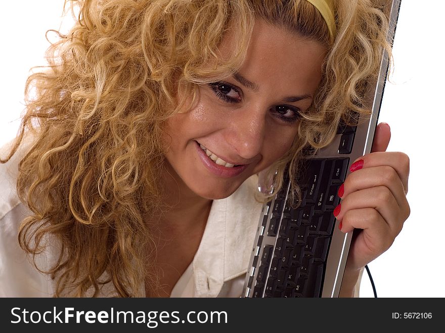 Young blonde woman holding keyboard of computer