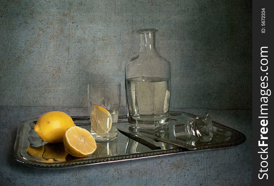 Salver with water and lemons. Salver with water and lemons